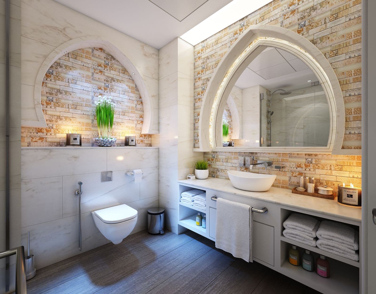 Spa bathroom concept with vessel sink and warm mosaic wall
